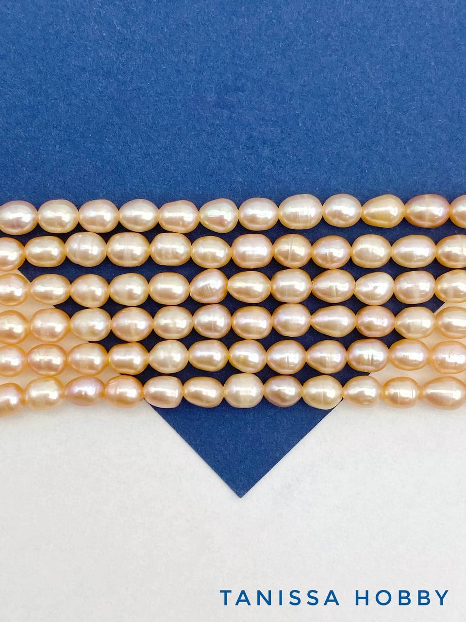 Жемчуг рис культивированный, персиковый, 5-6мм, А, нить, Ж094