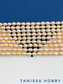 Жемчуг рис культивированный, персиковый, 7мм, А-, нить, Ж011